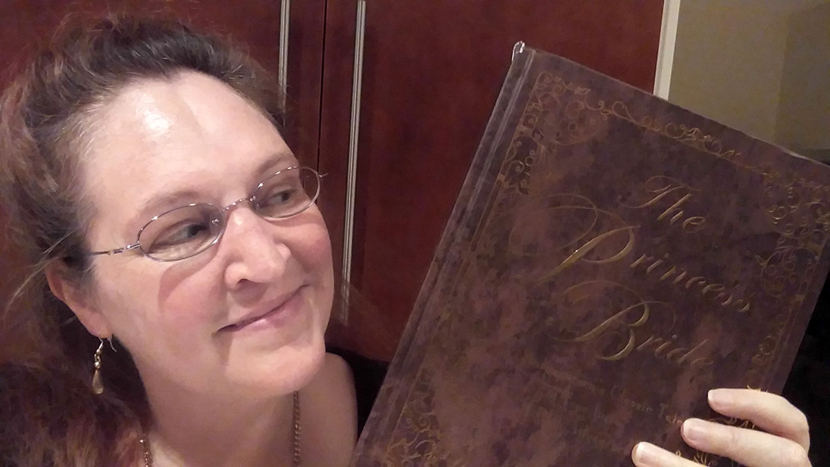 Carma Spence holding a copy of The Princess Bride Deluxe Edition